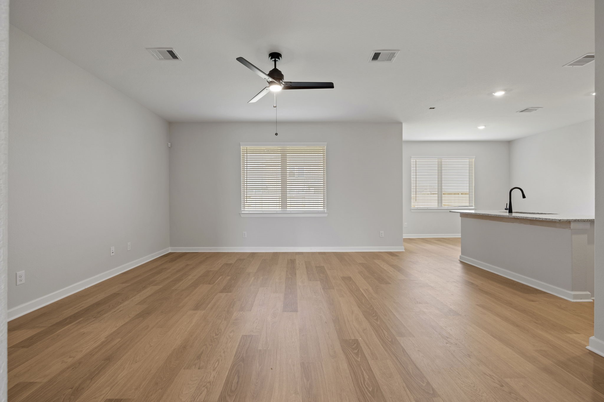13601 Gaff Rig Drive Texas City, TX 77510 - Photo 4 of 20 a view of an empty room with wooden floor and a window