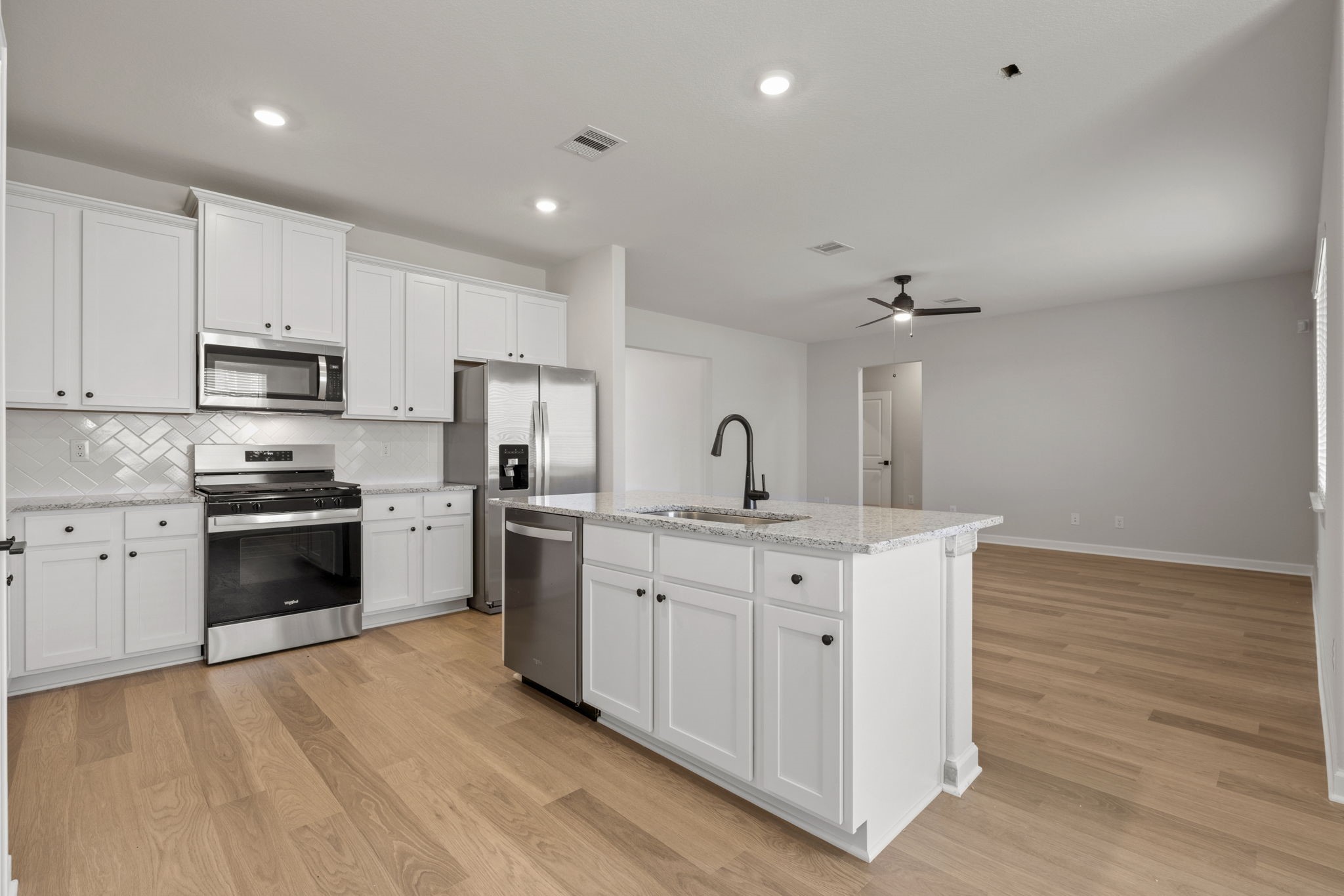 13601 Gaff Rig Drive Texas City, TX 77510 - Photo 7 of 20 a kitchen with appliances a sink and cabinets