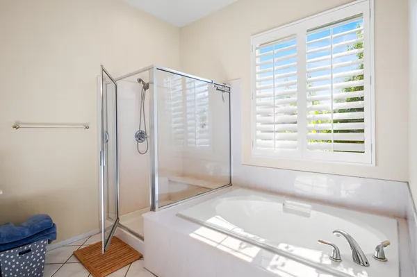 a bathroom with a tub and a sink