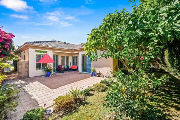 a view of house with yard outdoor seating and entertaining space