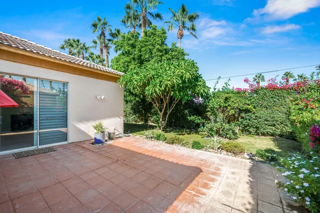a blue bench sitting in front of a building