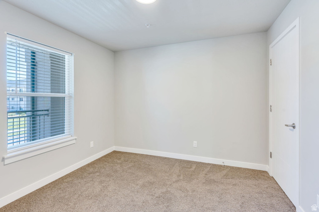 572 South 100 West, Unit E210 Springville, UT 84663 - Photo 19 of 35 Room featuring carpet flooring, light neutral-toned walls, and a window with blinds