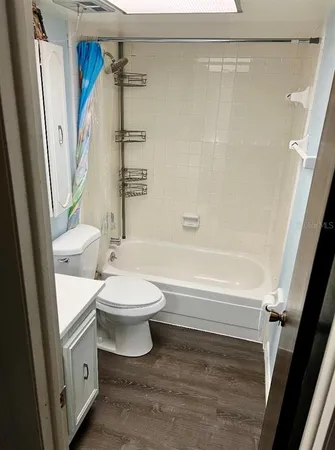 a bathroom with a toilet a sink and a shower