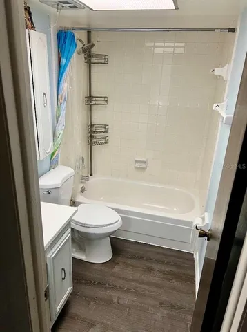 a bathroom with a toilet a sink and a shower