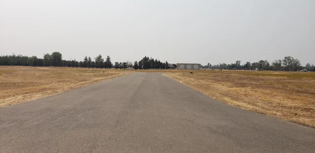 a view of a backyard of a house
