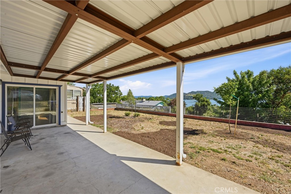 13701 Arrowhead Road Clearlake, CA 95422 - Photo 4 of 21 Patio off the main bedroom and the living room allows for outdoor living while admiring the view.