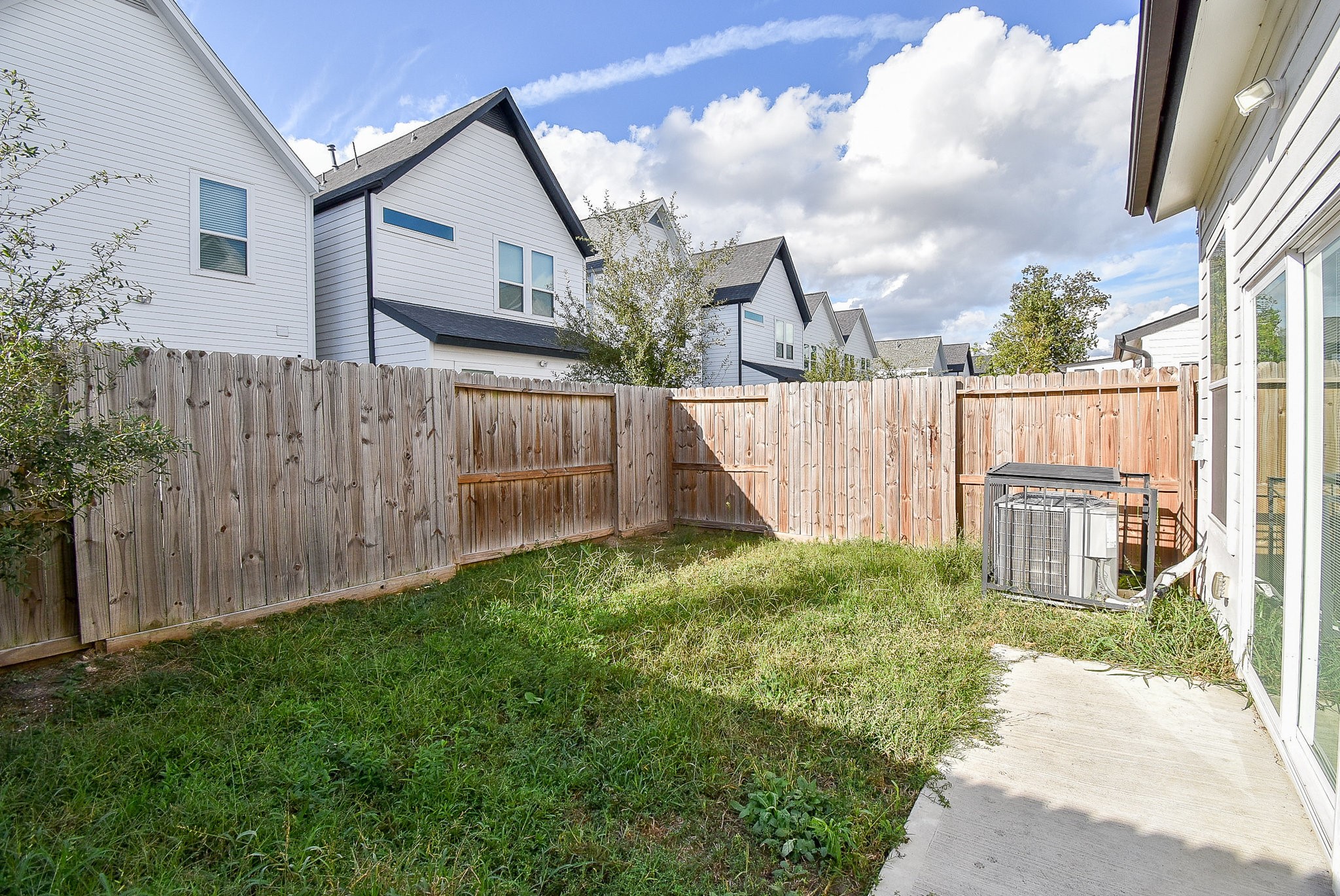 6828 Liverpool Street Houston, TX 77021 - Photo 32 of 32 a view of backyard with garden and wooden fence