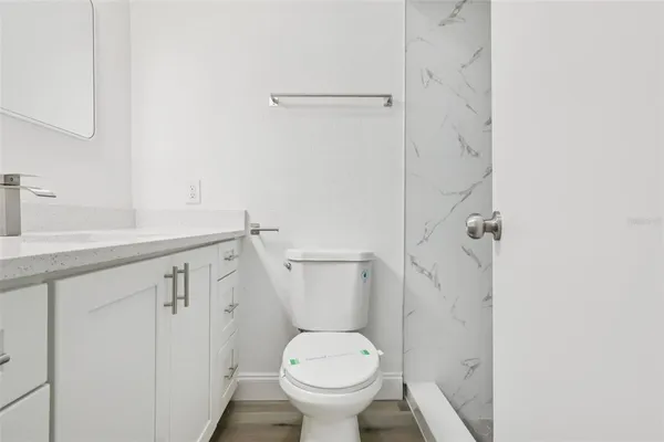 a bathroom with a sink and toilet