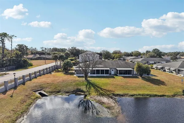 a view of a swimming pool with a lawn chairs