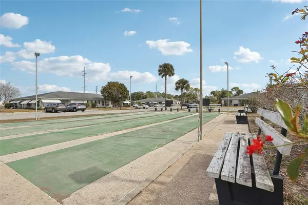 a park with lots of traffic signal lights