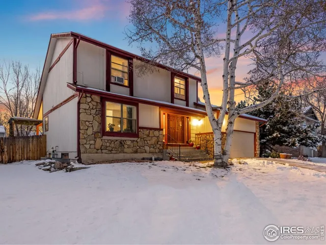 a view of a porch with furniture and floor to ceiling window