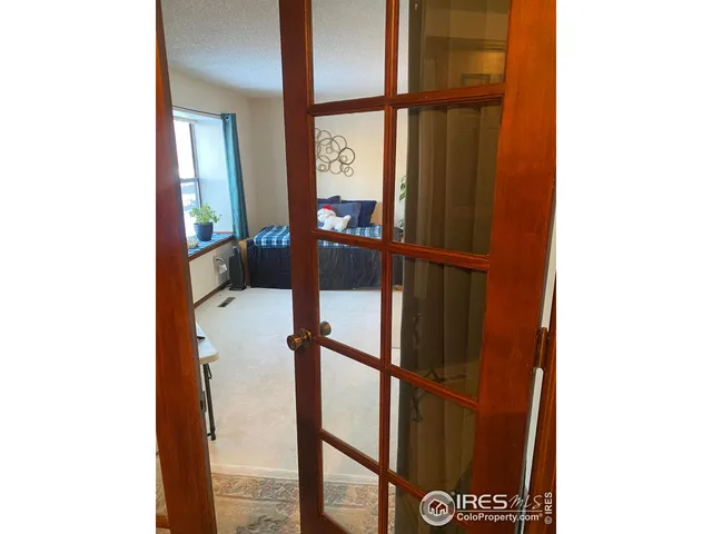 a bedroom with a bed and a potted plant