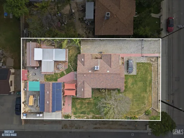 an aerial view of houses with yard