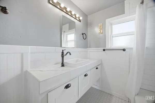 a bathroom with a sink and a mirror