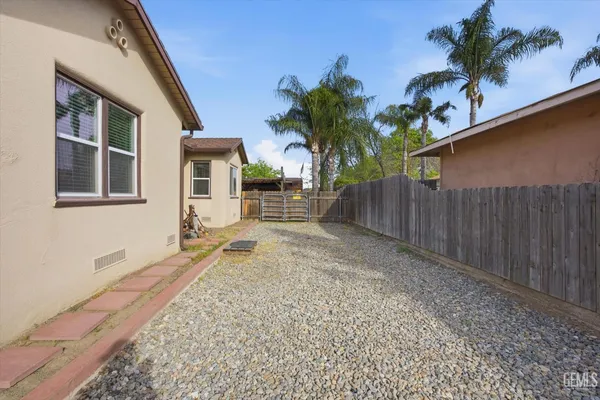a house with palm tree in front of it