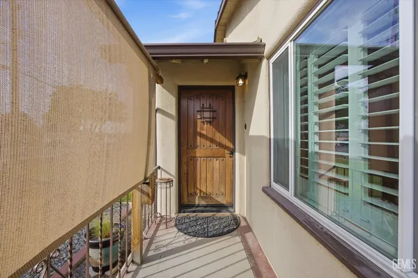 a view of a balcony with wooden floor and stairs