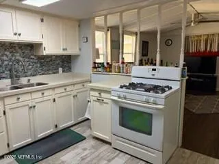 a bed room with a bed and a chair