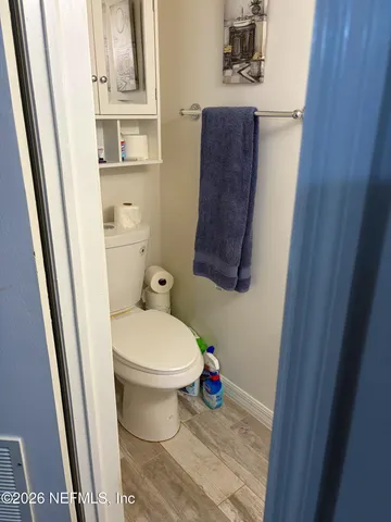 a bedroom with a bed dresser and a window