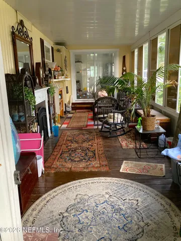 a living room with furniture and a rug