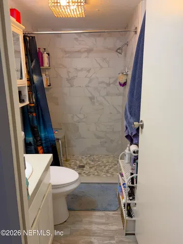 a view of an house with backyard space and balcony