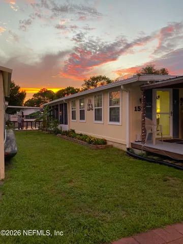 a view of a patio with table and chairs