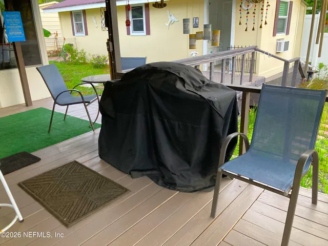 a view of a deck and backyard