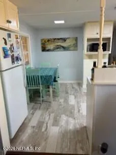 a living room with furniture rug and wooden floor