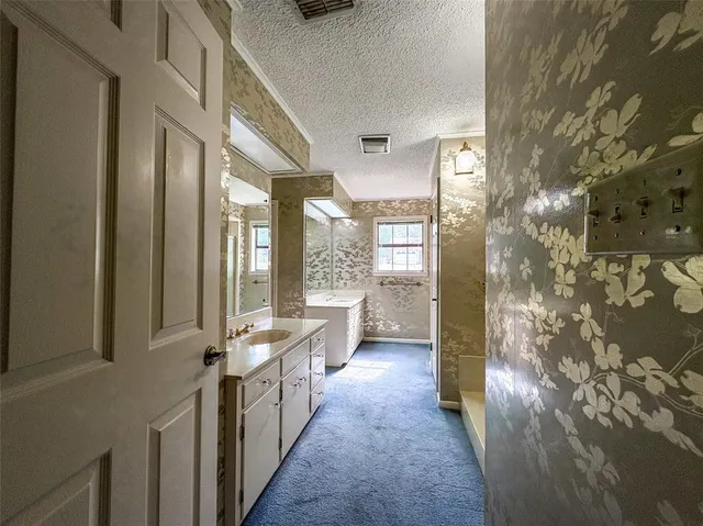 a view of a hallway with windows