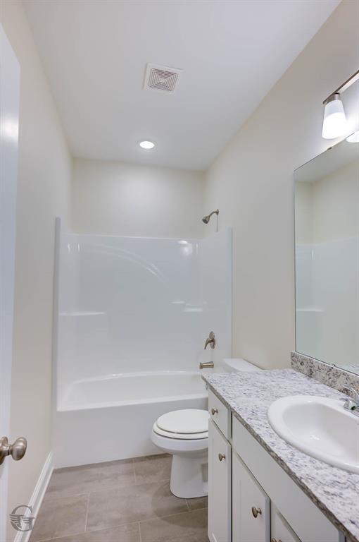 1210 BAYOU BAY Court Frierson, LA 71027 - Photo 12 of 21 a bathroom with a granite countertop toilet a sink and a bathtub