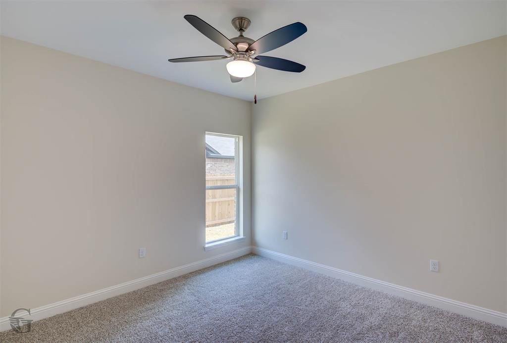 1210 BAYOU BAY Court Frierson, LA 71027 - Photo 13 of 21 an empty room with windows and ceiling fan