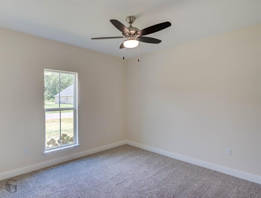 1210 BAYOU BAY Court Frierson, LA 71027 - Photo 10 of 21 an empty room with a window and a ceiling fan