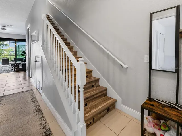 a view of entryway and hall with wooden floor