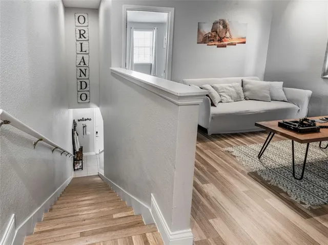 a living room with furniture and a rug