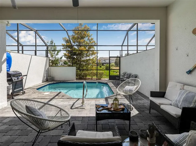 a room with table chairs and windows