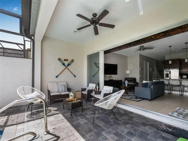 a living room with furniture and a large window