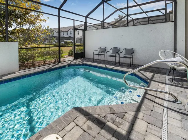 a view of a chairs and table in the patio