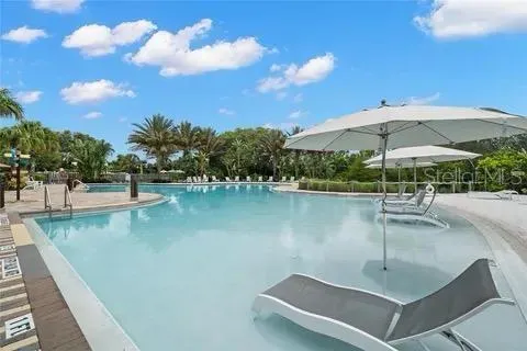 a view of a swimming pool with a patio