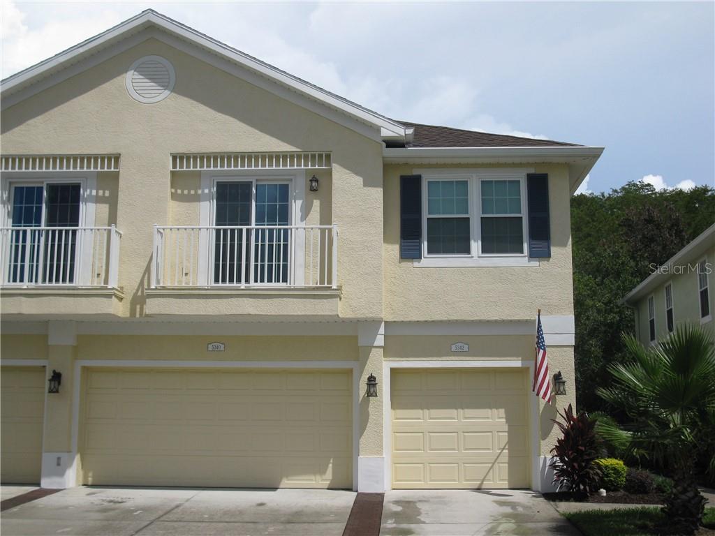 5342 Anhinga Trail New Port Richey, FL 34653 - Photo 1 of 1 a front view of a house with a garage
