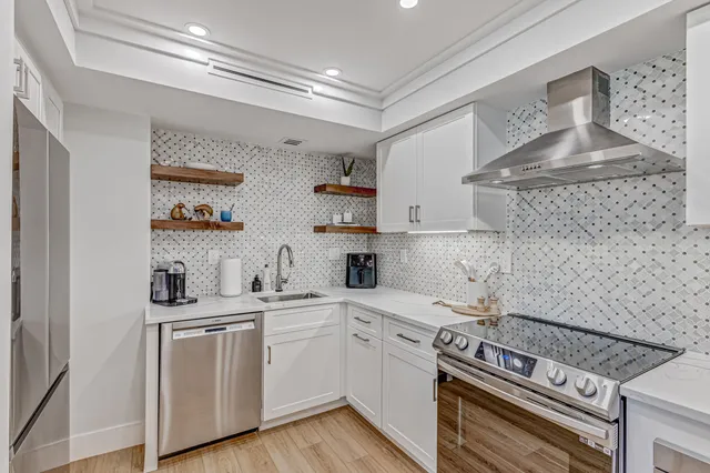 a kitchen with a stove and cabinets