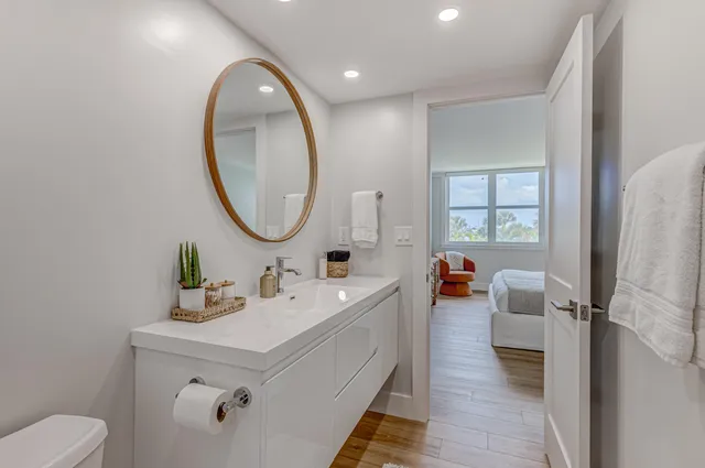 a bathroom with a sink and a mirror