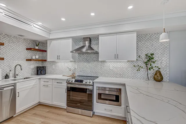 a kitchen with a white cabinets and white appliances