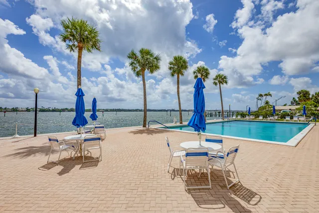 a very nice looking room with a chandelier and wooden floor