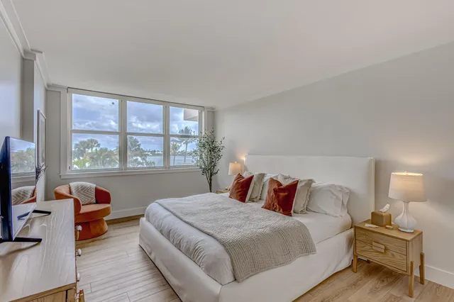 a bedroom with a bed and a couch