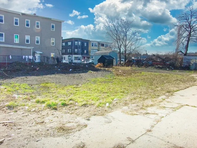 a swimming pool in the backyard of a building