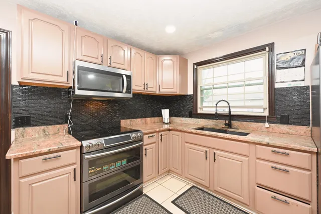 a bedroom with furniture and window
