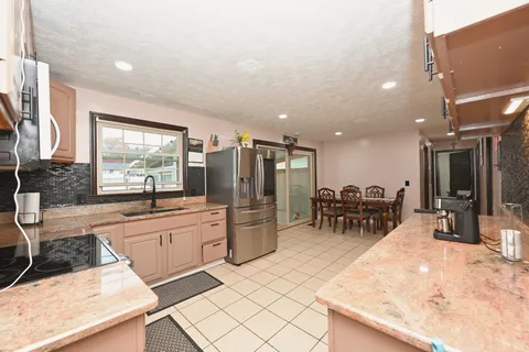 a bedroom with a bed and a table in it