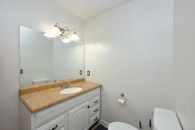 a work room with furniture and white walls