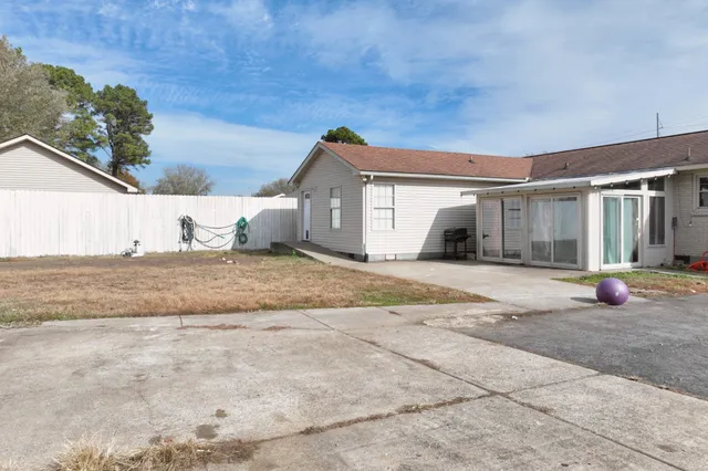 a kitchen with stainless steel appliances a refrigerator sink and cabinets