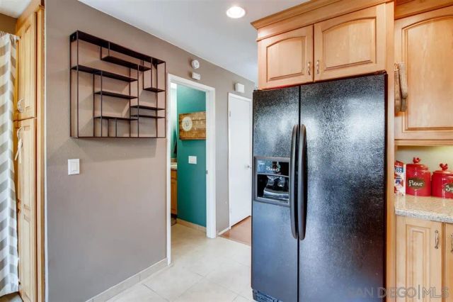 a view of a hallway with wooden shelves