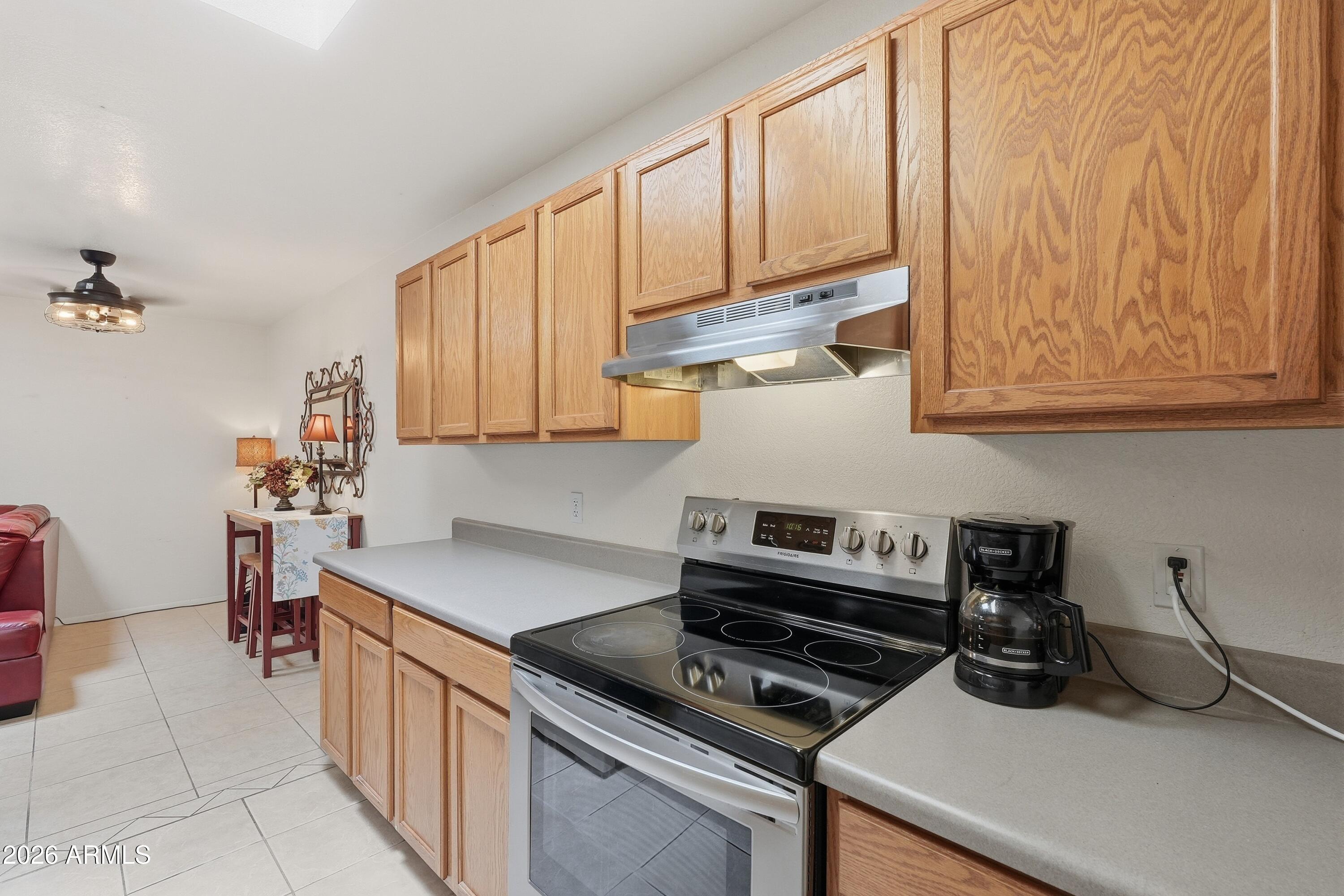 14300 West Bell Road, Unit 141 Surprise, AZ 85374 - Photo 6 of 23 8Kitchen Looking to Dining Area